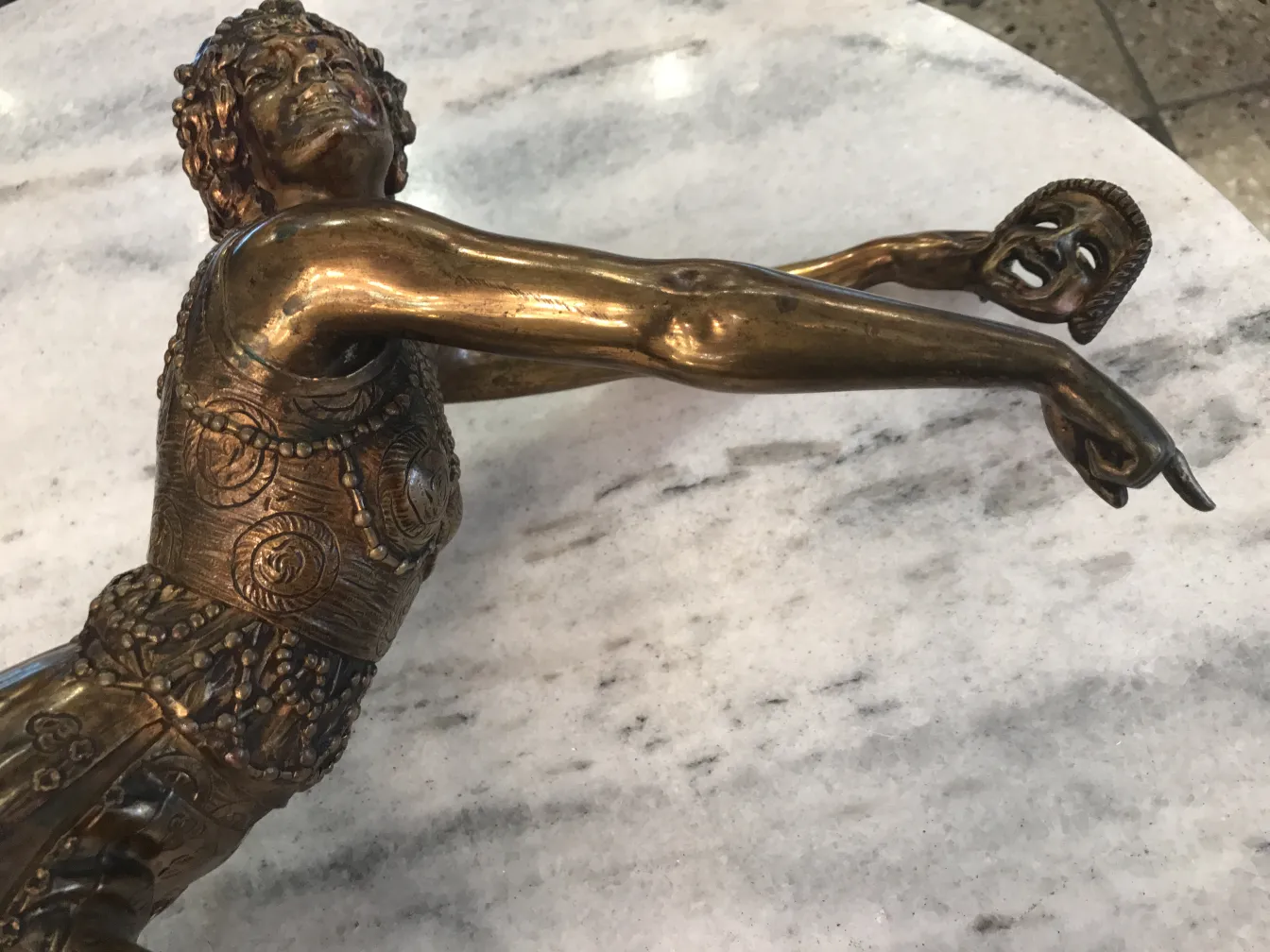 ancient sculpture with decorative details and expression