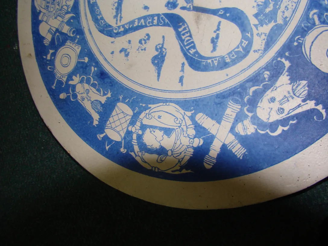 Antique ceramic plate decorated with blue designs