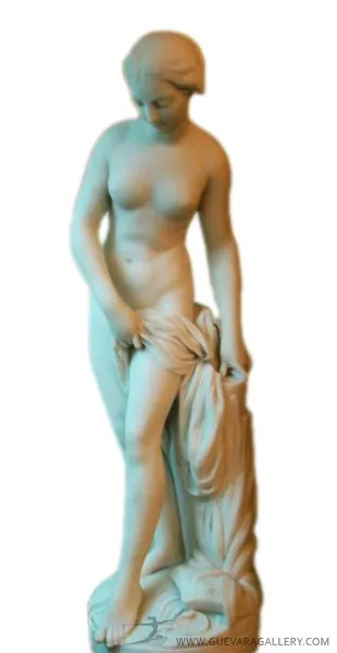 Antique sculpture of a standing female figure, draped in fabric.