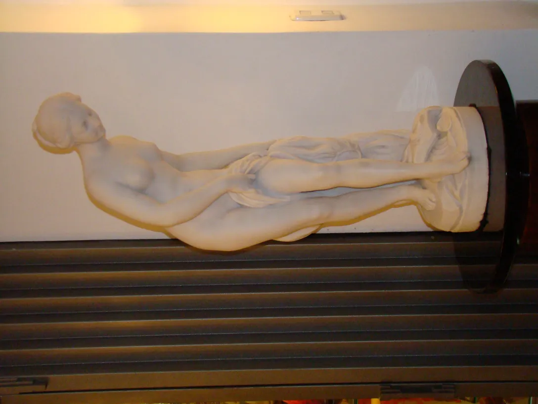 antique marble sculpture of a relaxed female figure