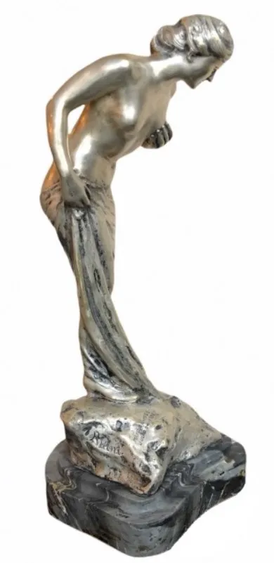 antique sculpture of an elegant and detailed female figure