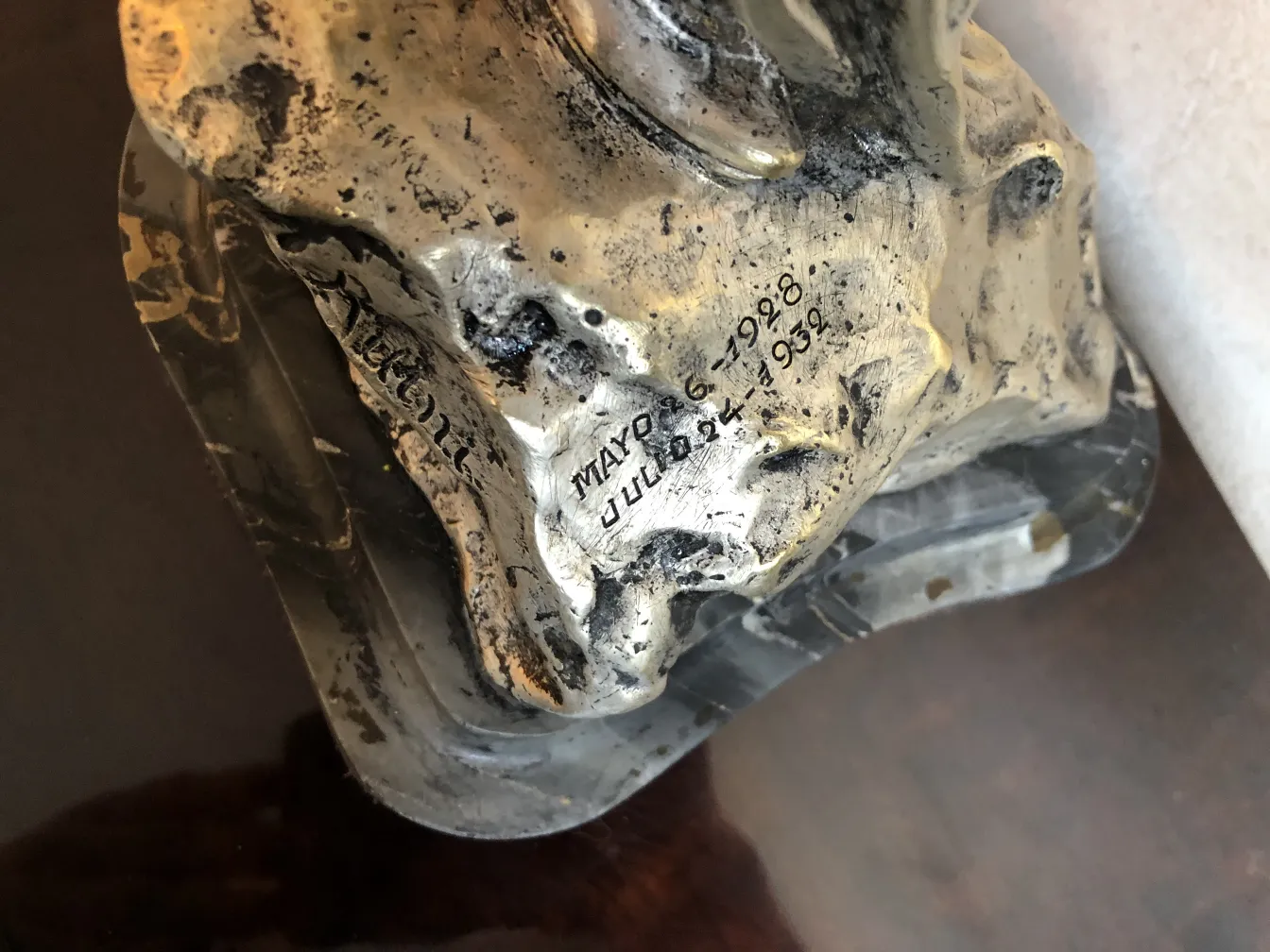 Antique sculpture featuring artisan craftsmanship with intricate details.