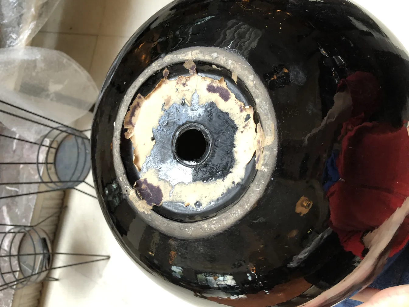 Top view of an antique black glossy ceramic with a hole