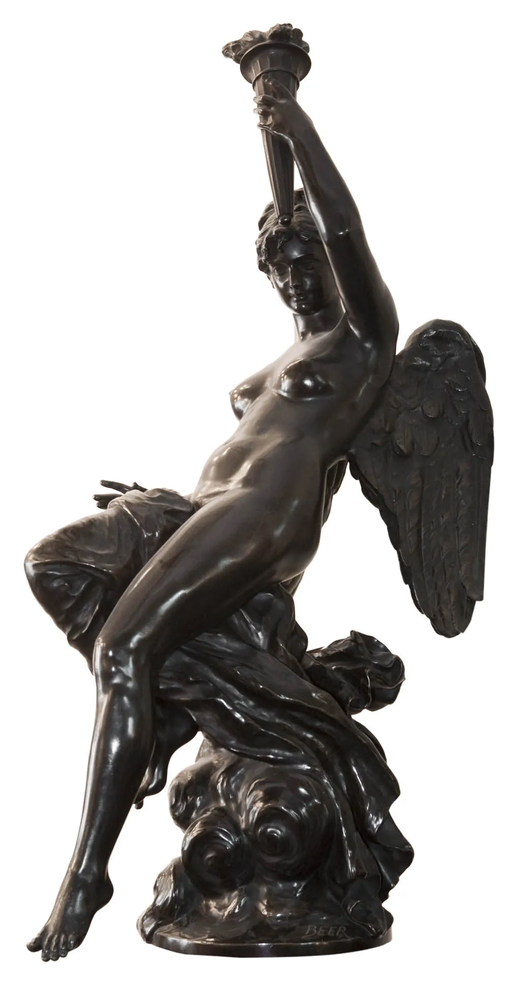 antique sculpture depicting a figure with wings and a torch
