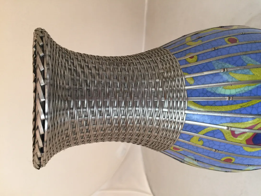 Antique colorful ceramic featuring prominent details and a seal at the base.