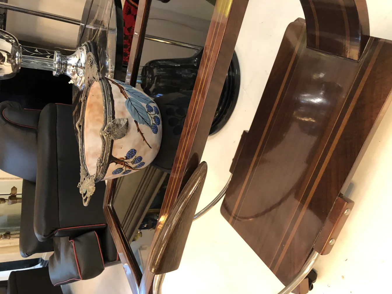 Antique ceramic adorned with leaves and berries, modern setting.