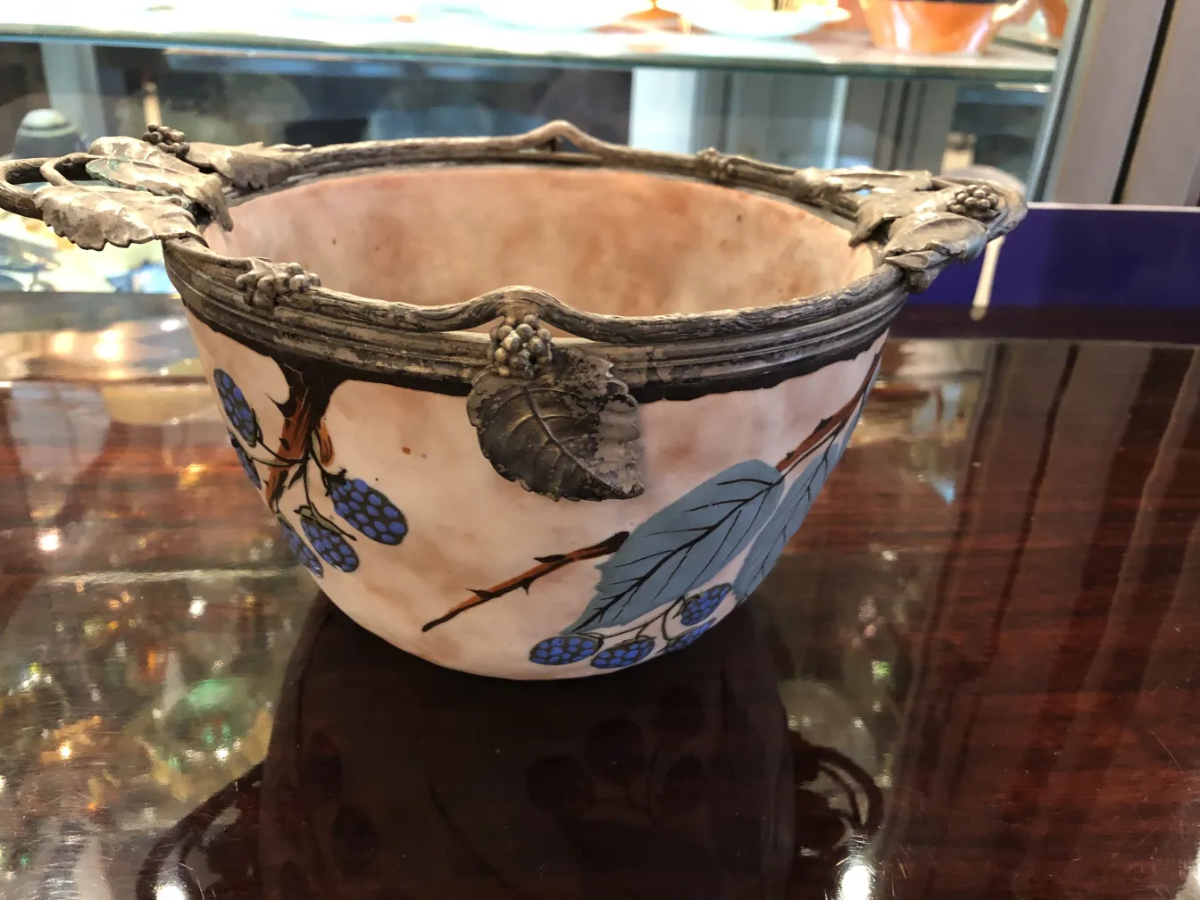 Beautiful antique ceramic with leaf and grape decoration, perfect for collectors.