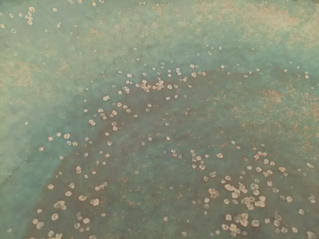 Antique ceramic featuring blue texture and decorative dots