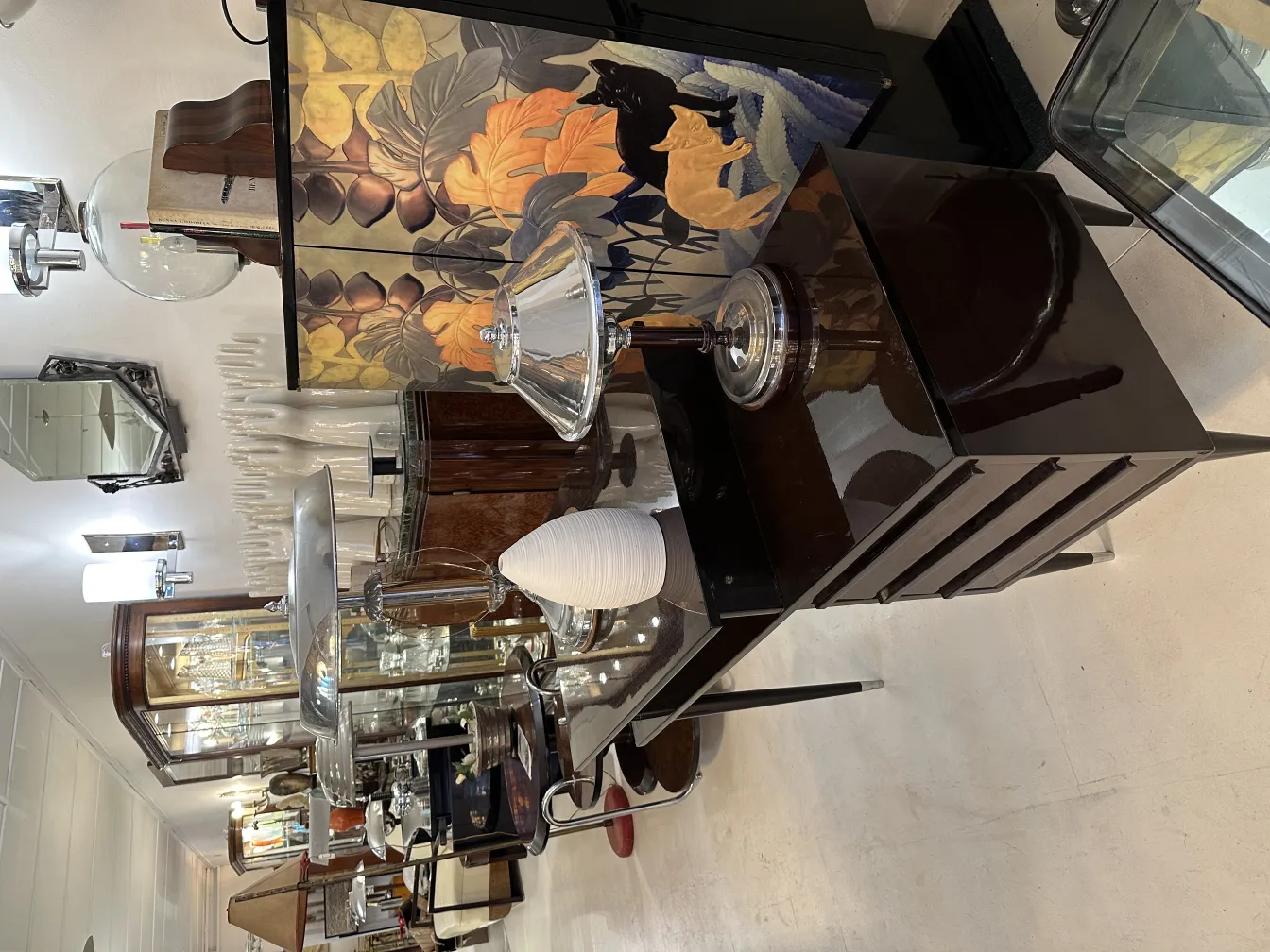 Antique decorative ceramic vase in an elegant environment with various objects.