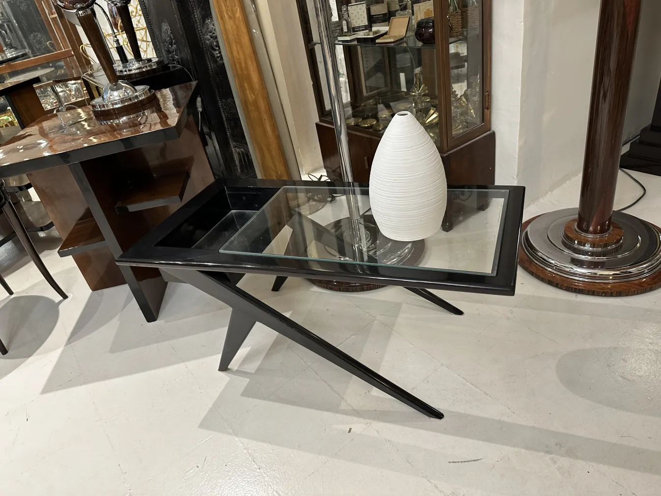 classic white ceramic vase placed on a glass table