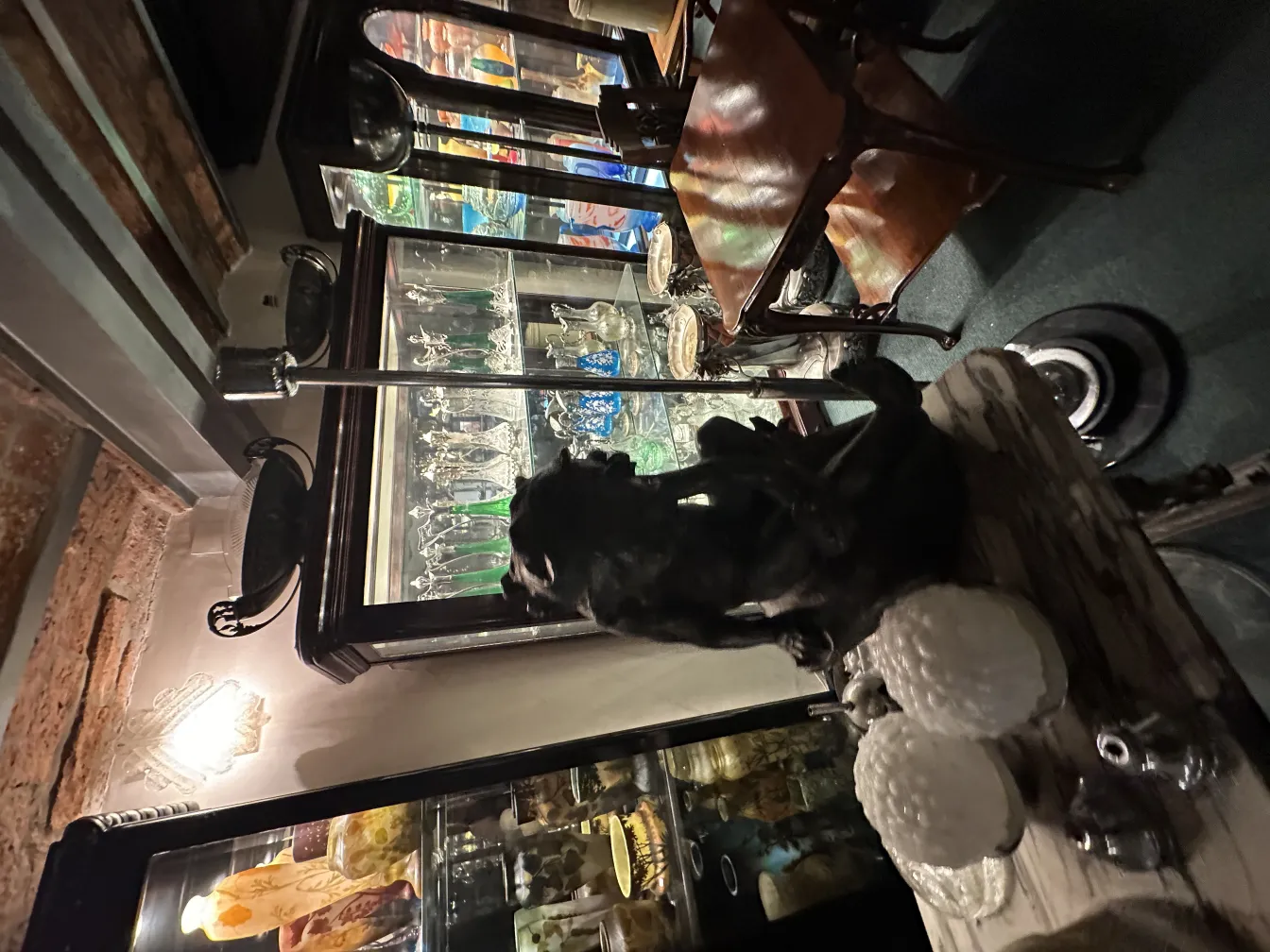 decorative antique sculpture on a table next to items