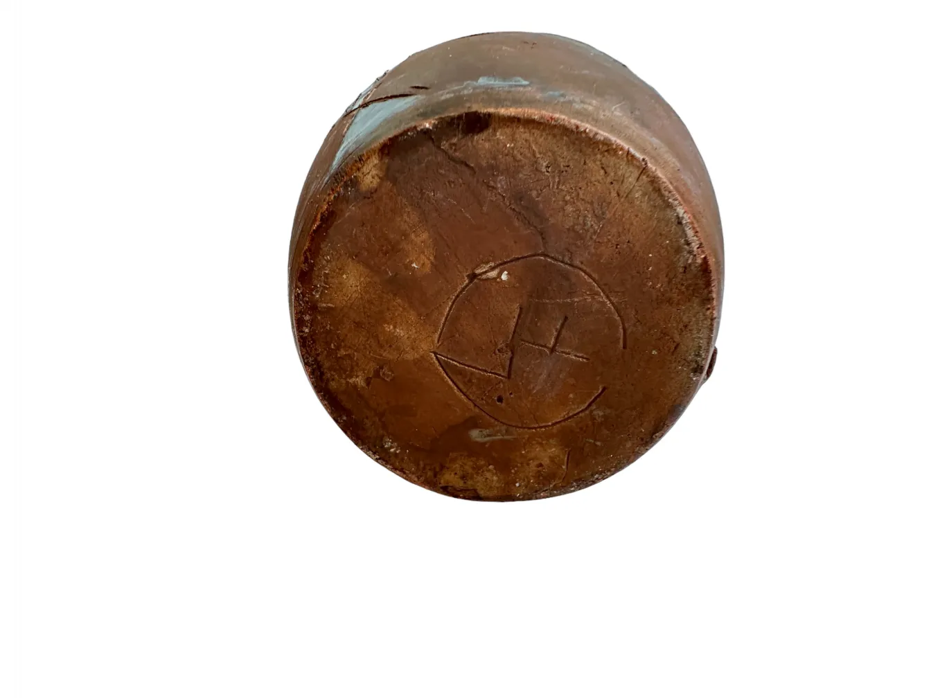 View of the base of an antique ceramic piece with engraved design