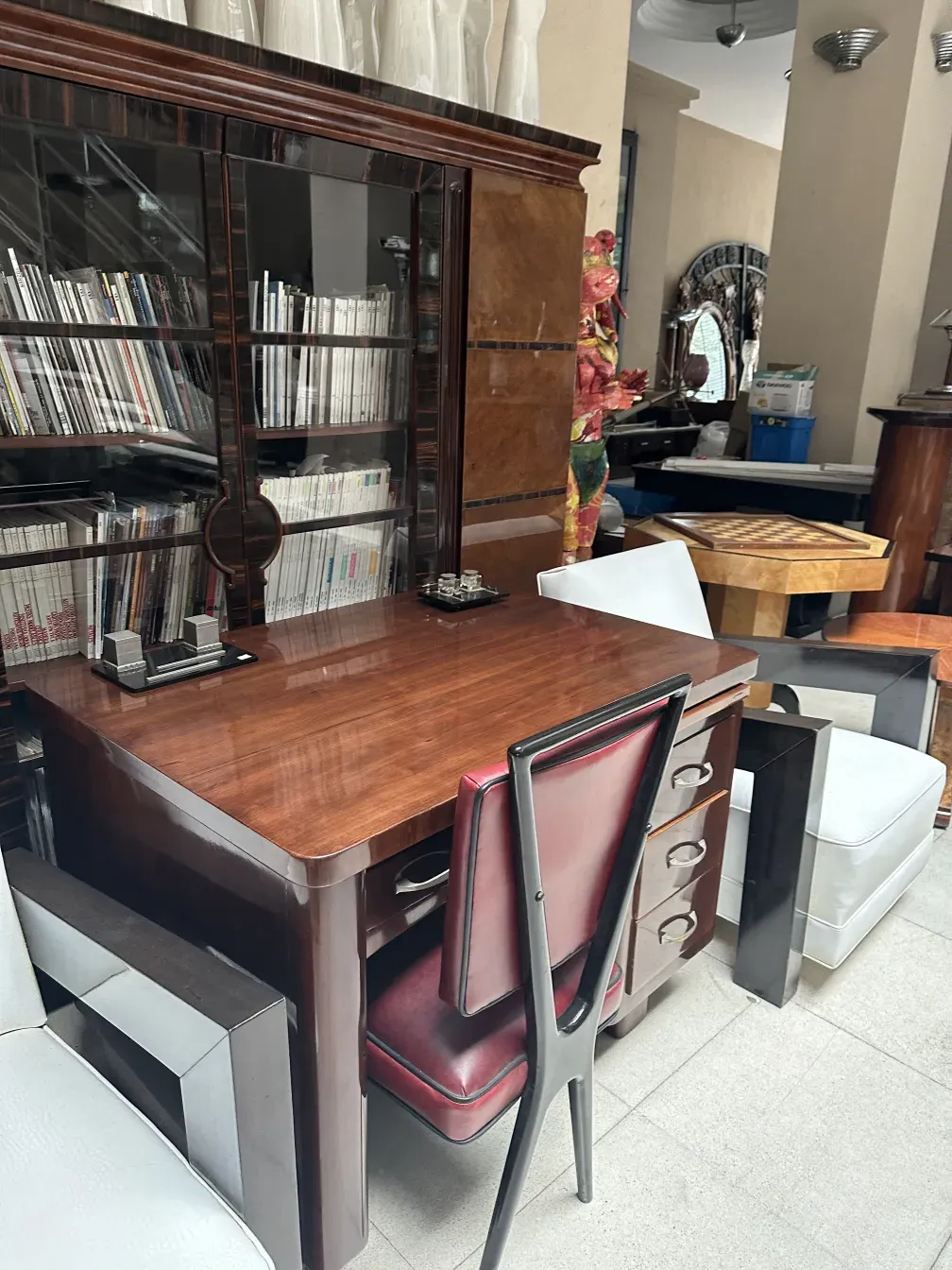 antique wooden desk with a decorative chair in a cozy setting
