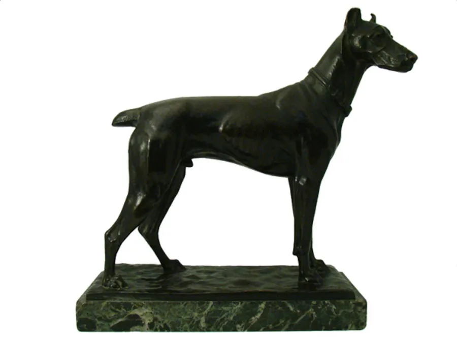 antique sculpture of a hunting dog on decorative base