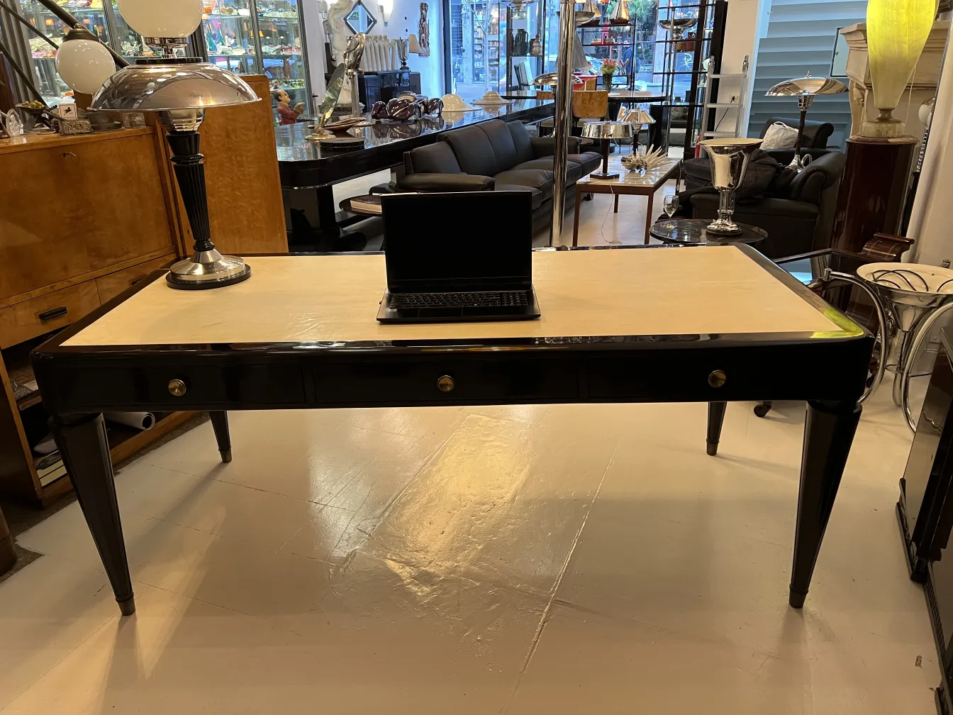 Antique desk with lamp and laptop on white table