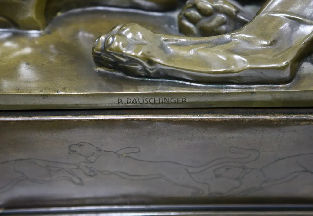 antique sculpture depicting animals in motion with the signature R. Dauschinger