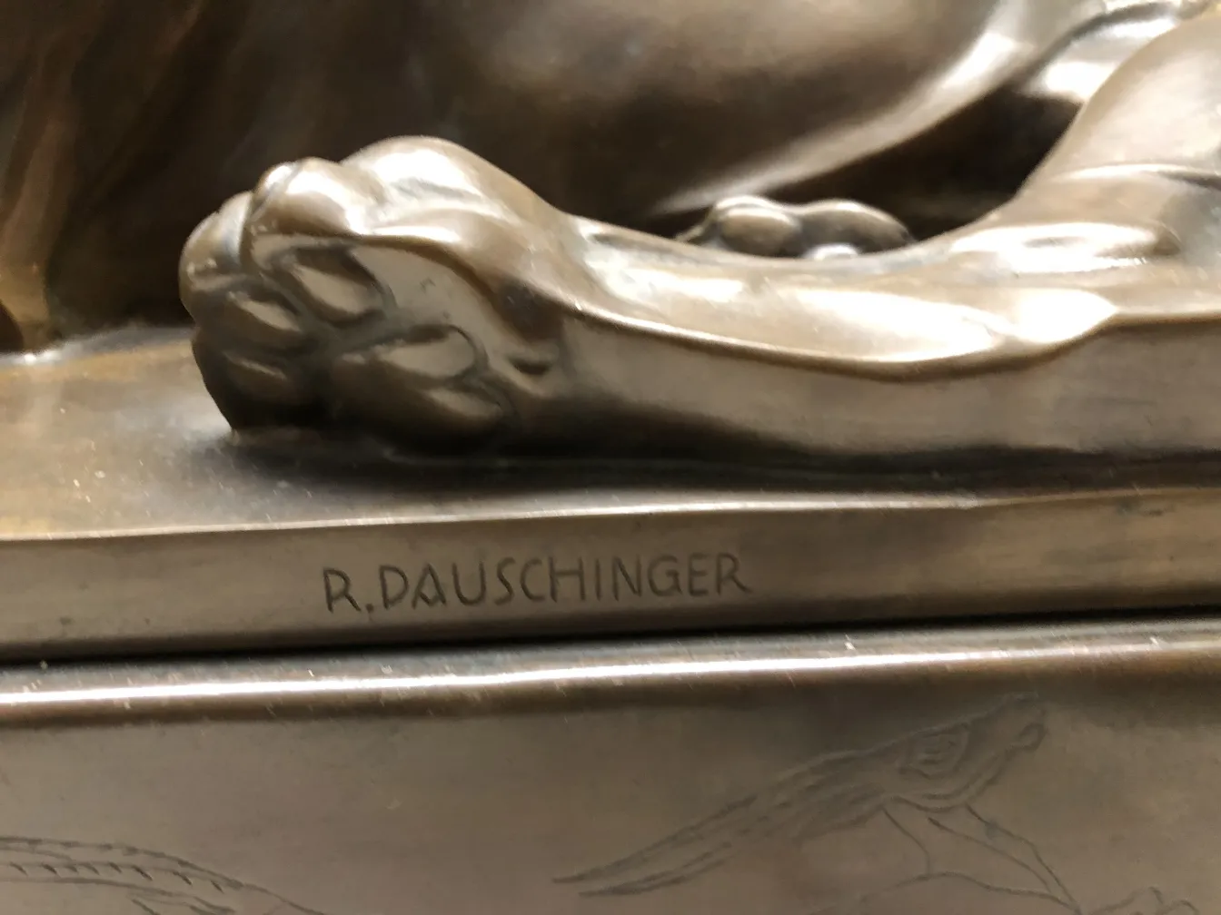 antique sculpture featuring visible artistic details