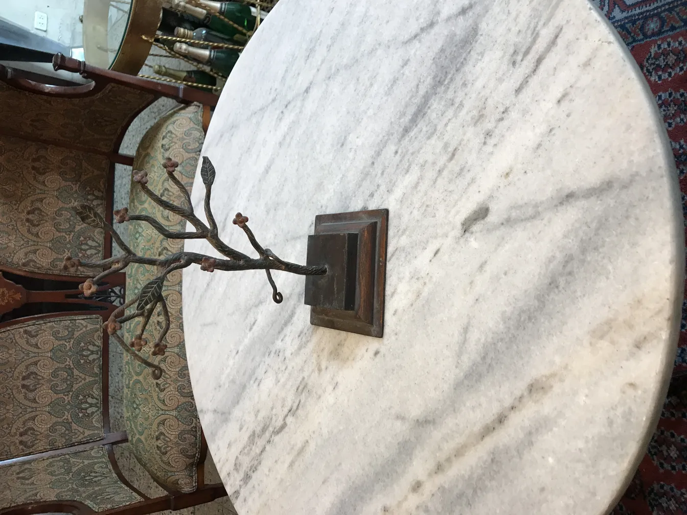 decorative antique sculpture, branches and flowers in a classic environment