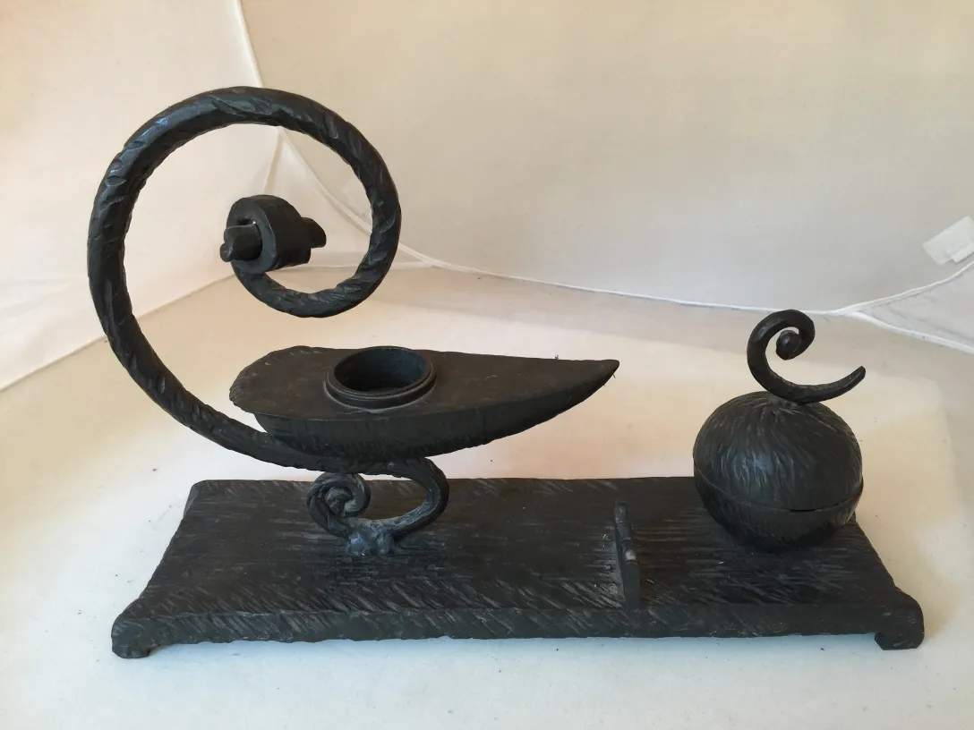 Antique decorative sculpture with curved design and base