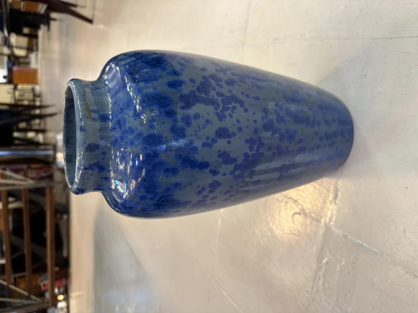 Antique blue vase with decorative spots