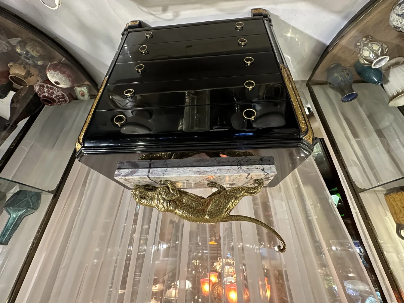 antique decorative sculpture featuring animal design in gold