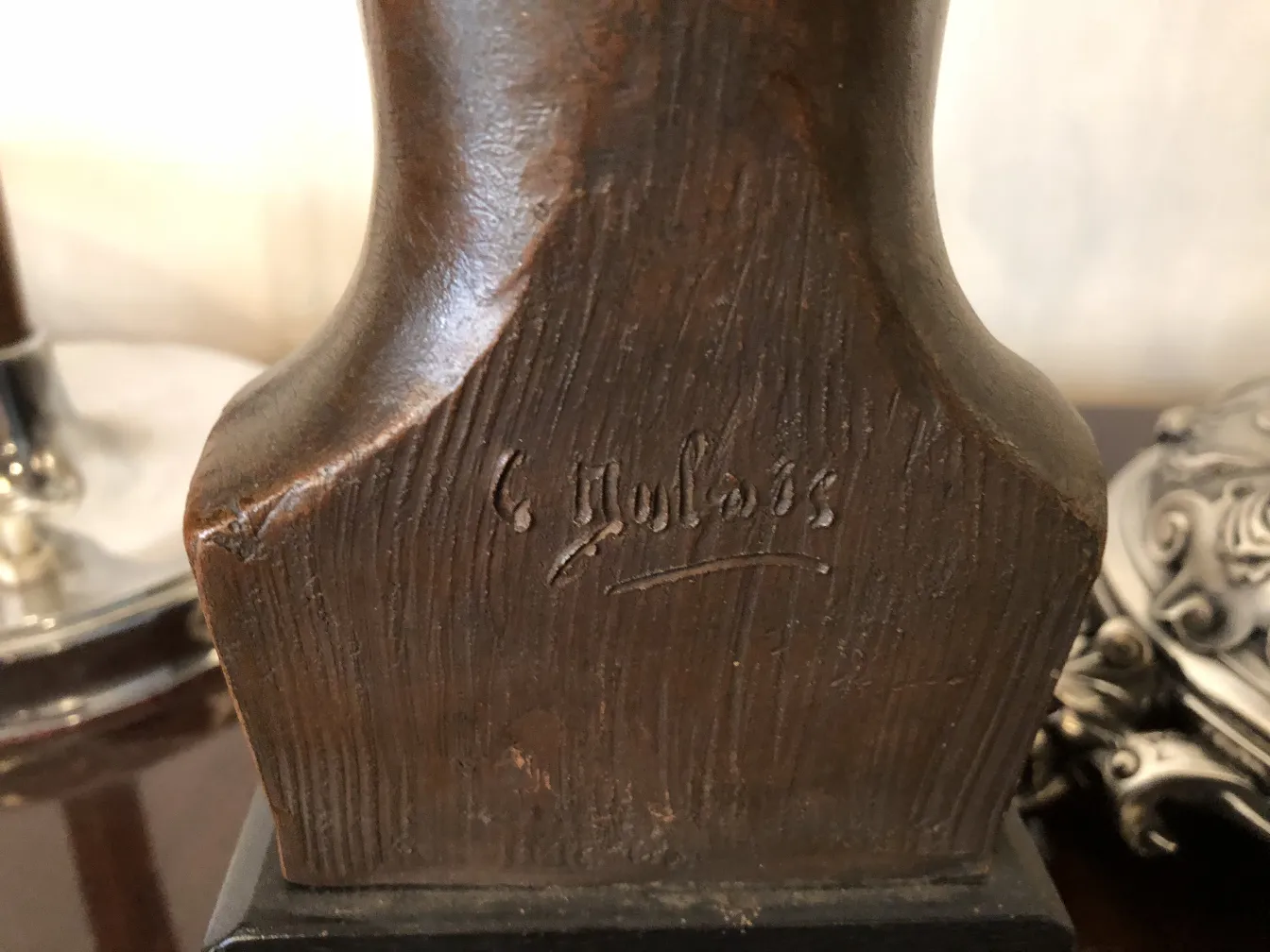 ancient sculpture with engraved details and decorative background