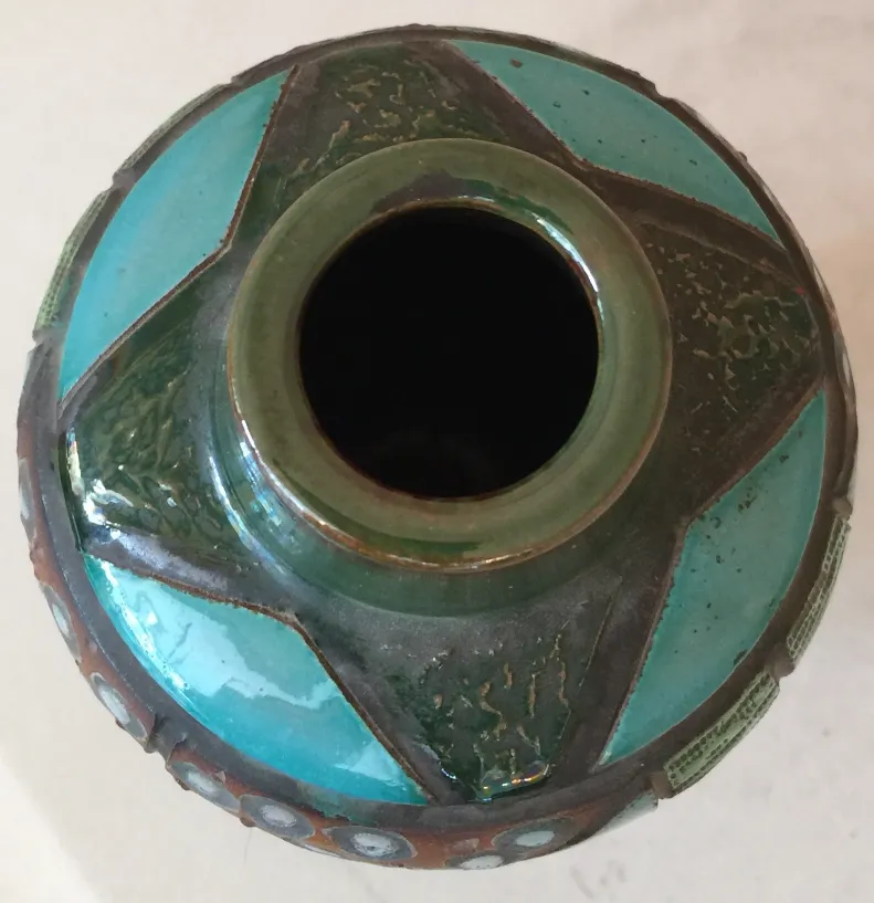 Antique vase with vibrant colors and unique design.