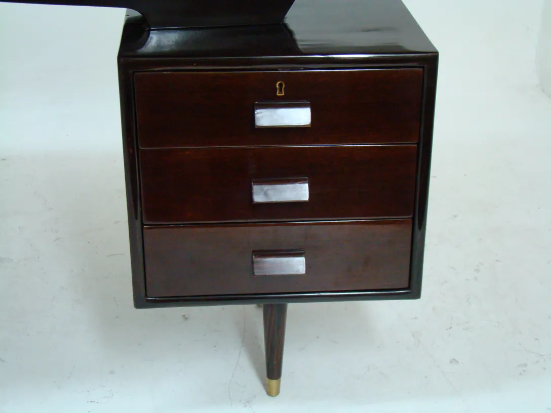antique desk with three drawers, light background