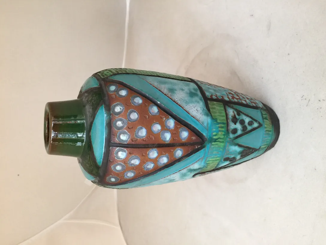 Antique ceramic vase decorated in vibrant colors