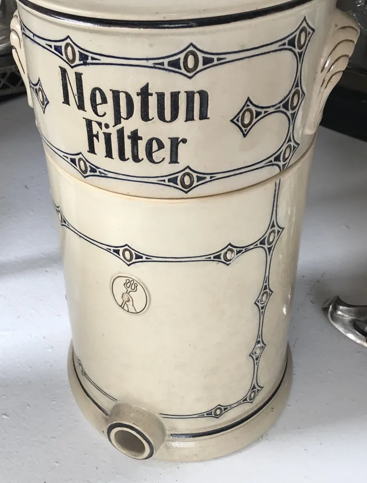 Antique Neptun filter ceramic with blue decoration.