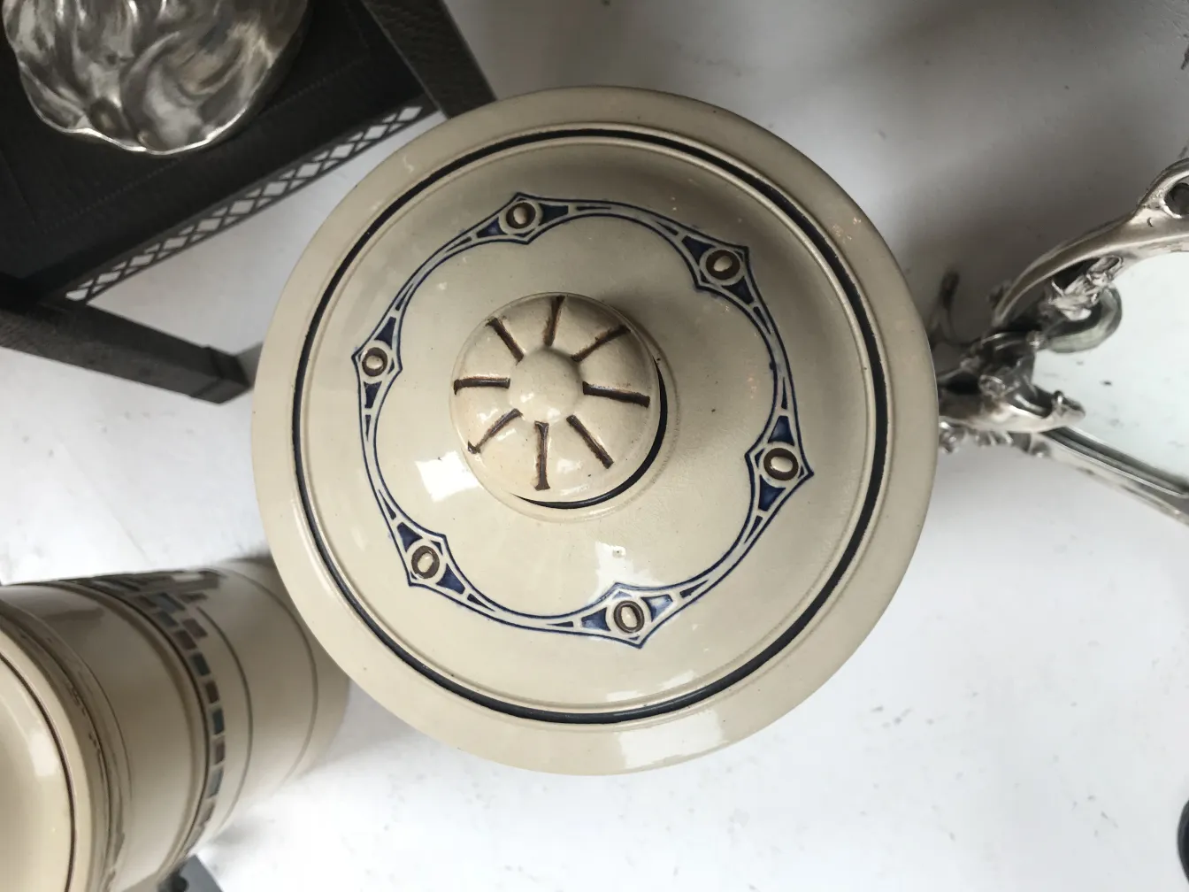 Antique ceramic lid with blue and beige details