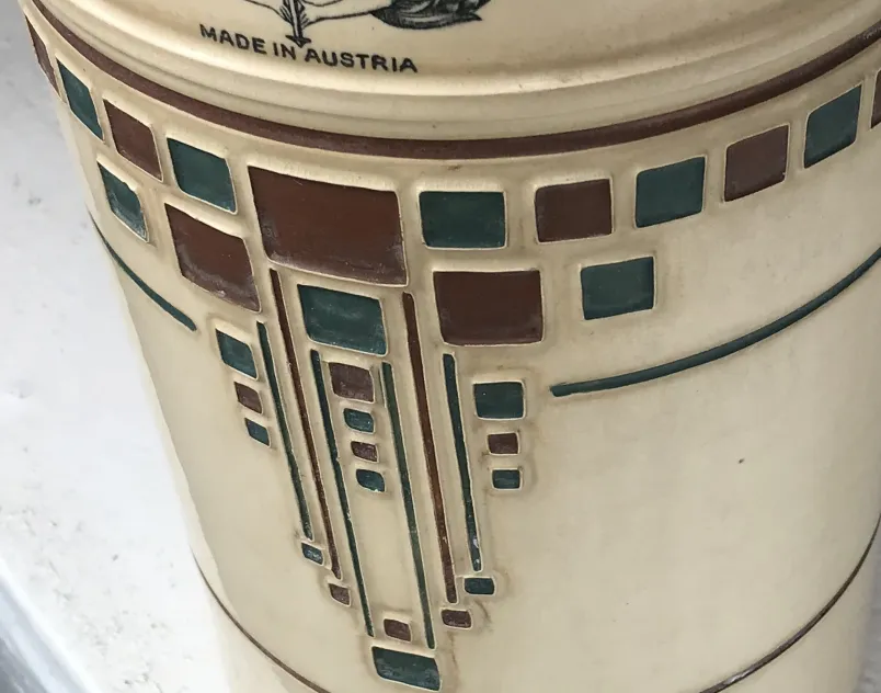 Antique ceramic with geometric colors and patterns on a light background