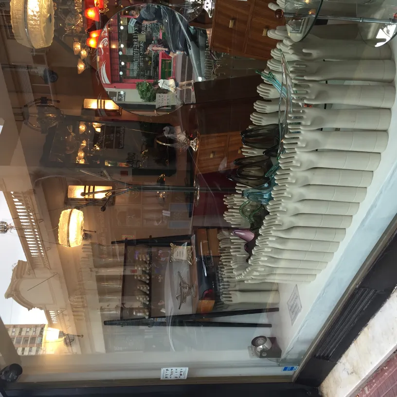 showcase with antique ceramics in various colors and shapes