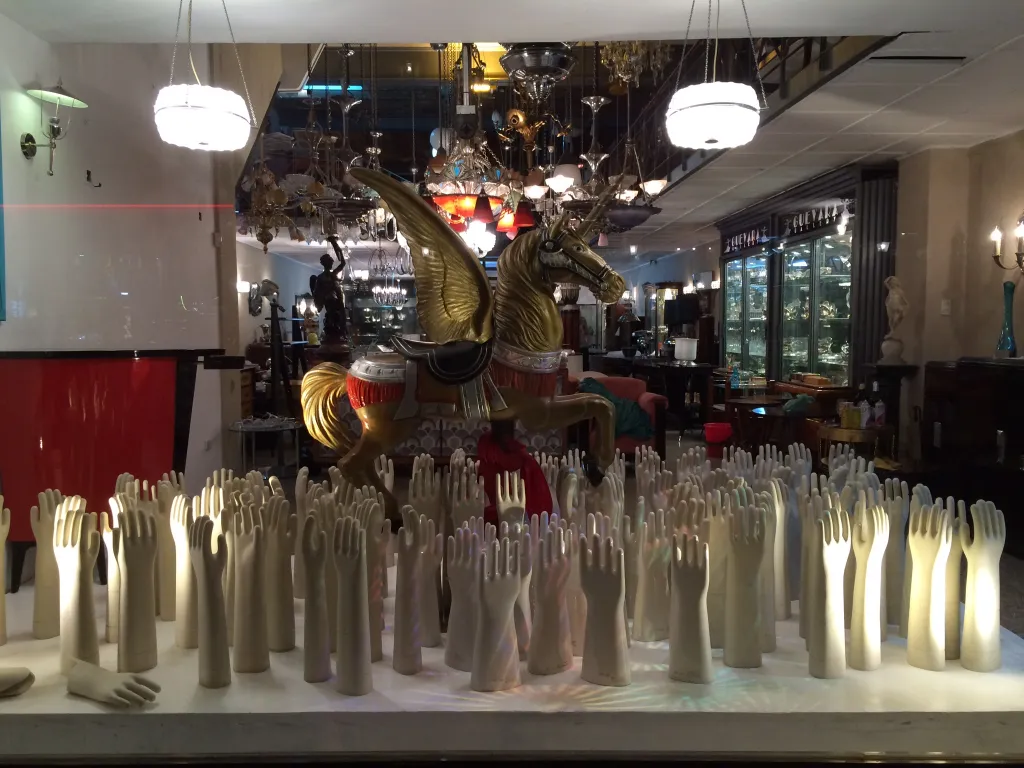 Display of antiques with light-colored decorative ceramics