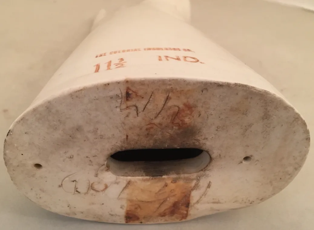 Bottom view of an antique decorative ceramic with visible markings.