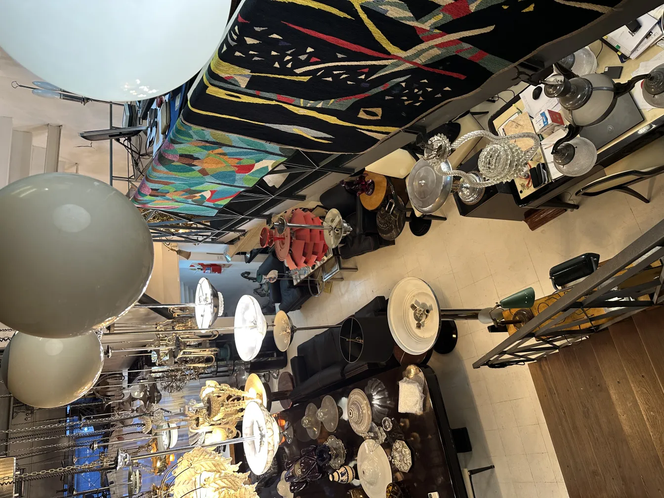 Five antique hanging lamps illuminating a cozy environment.