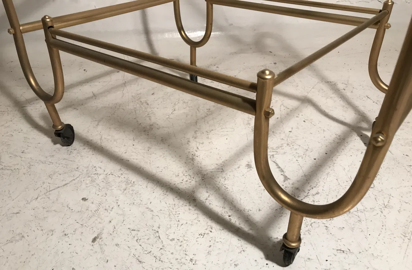 antique cocktail trolley with gold frame on white background