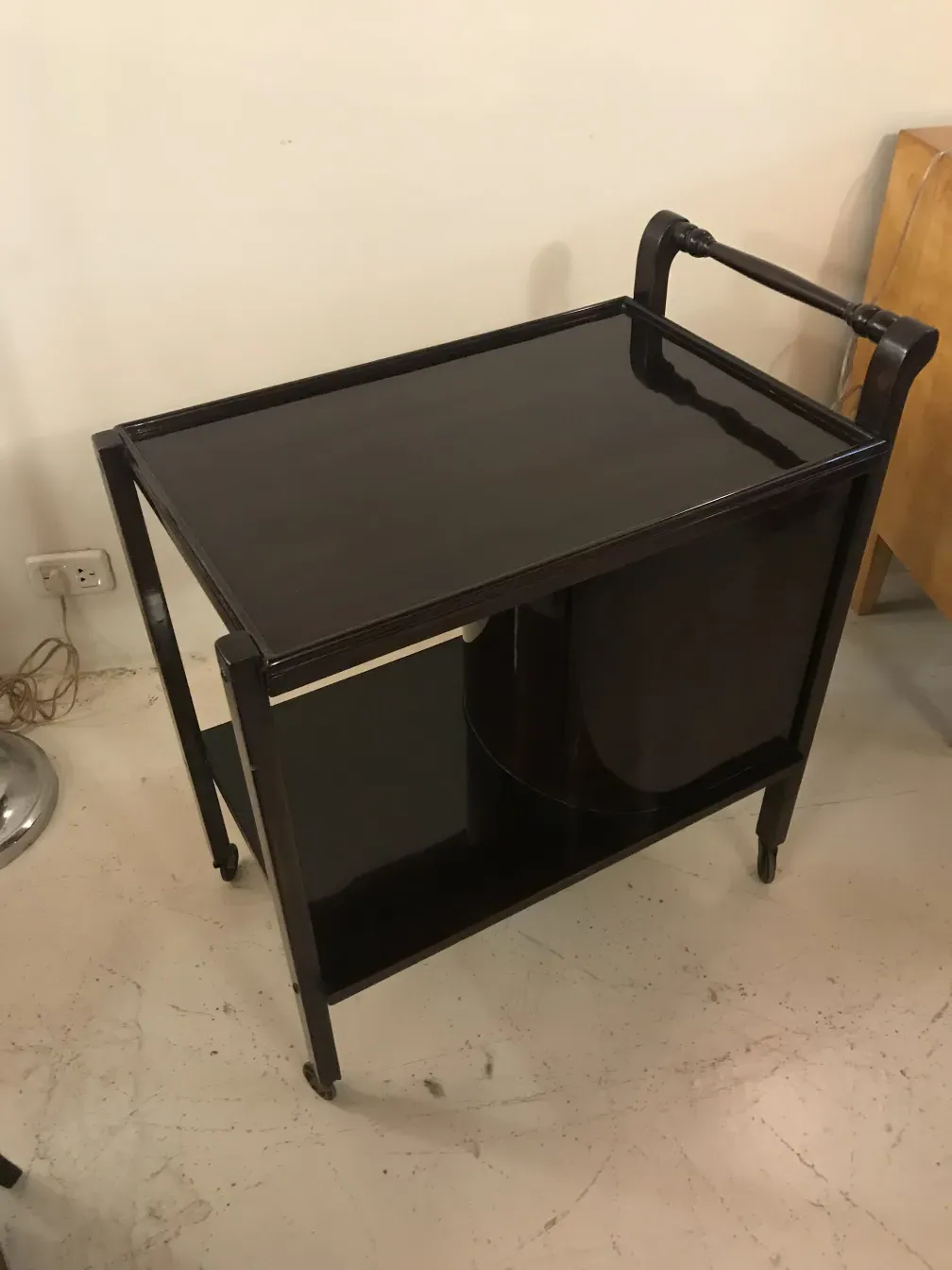 Dark antique cocktail trolley, stylish and functional.