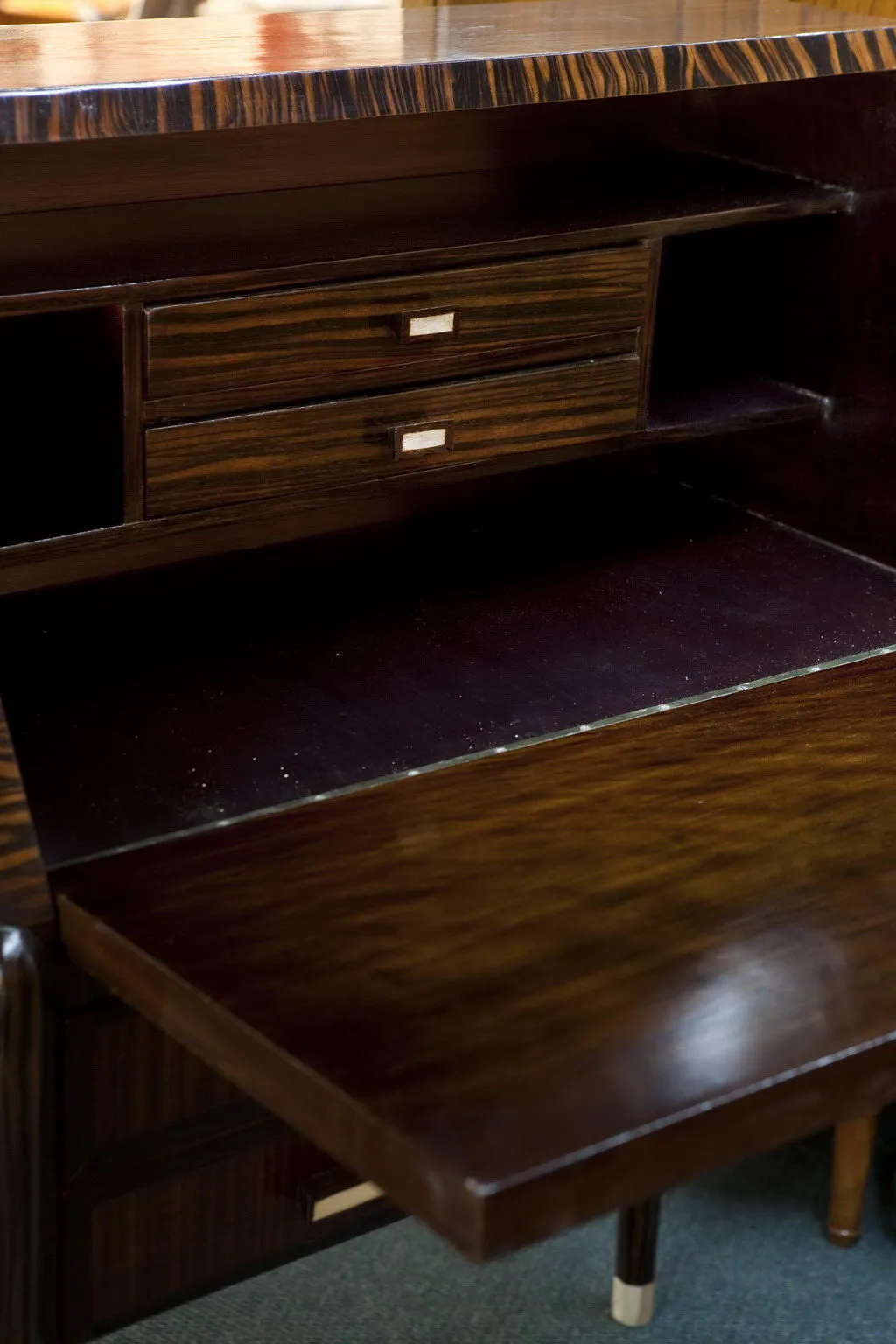 antique wooden desk with two visible drawers and shiny surface