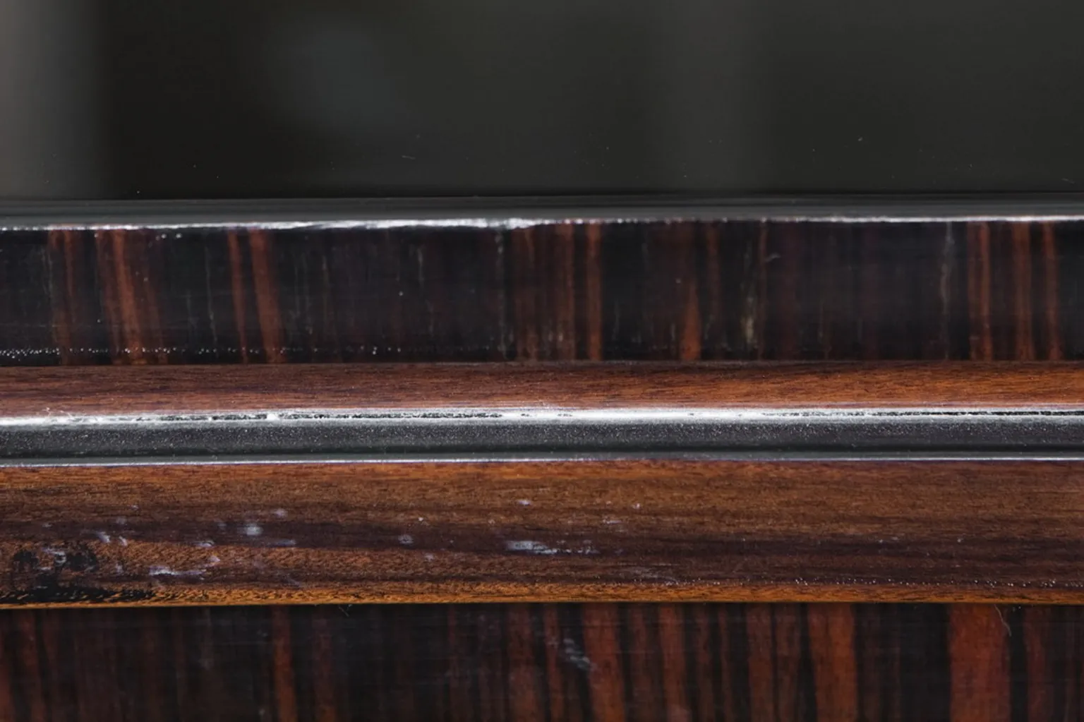 Antique wooden desk with elegant finish and subtle details.