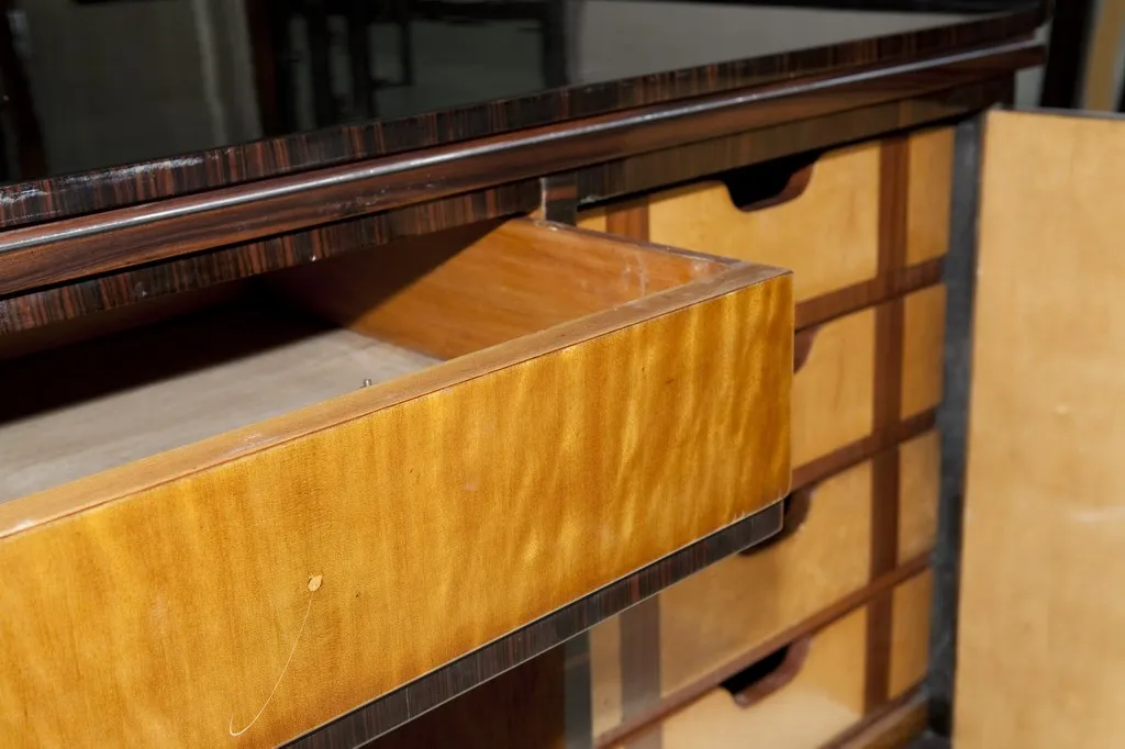 antique wooden desk with open drawers