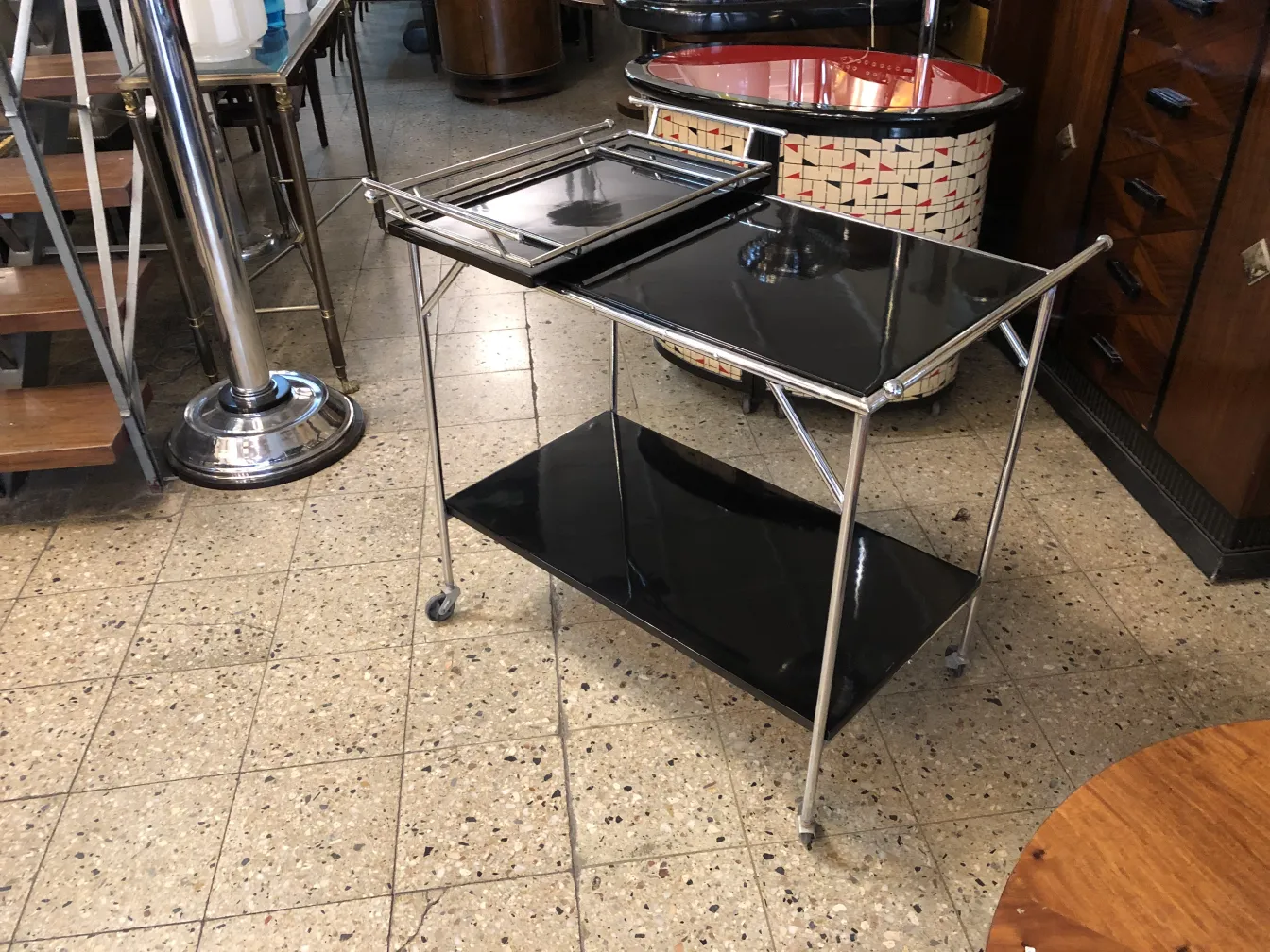 Antique cocktail trolley with black tray and metal legs