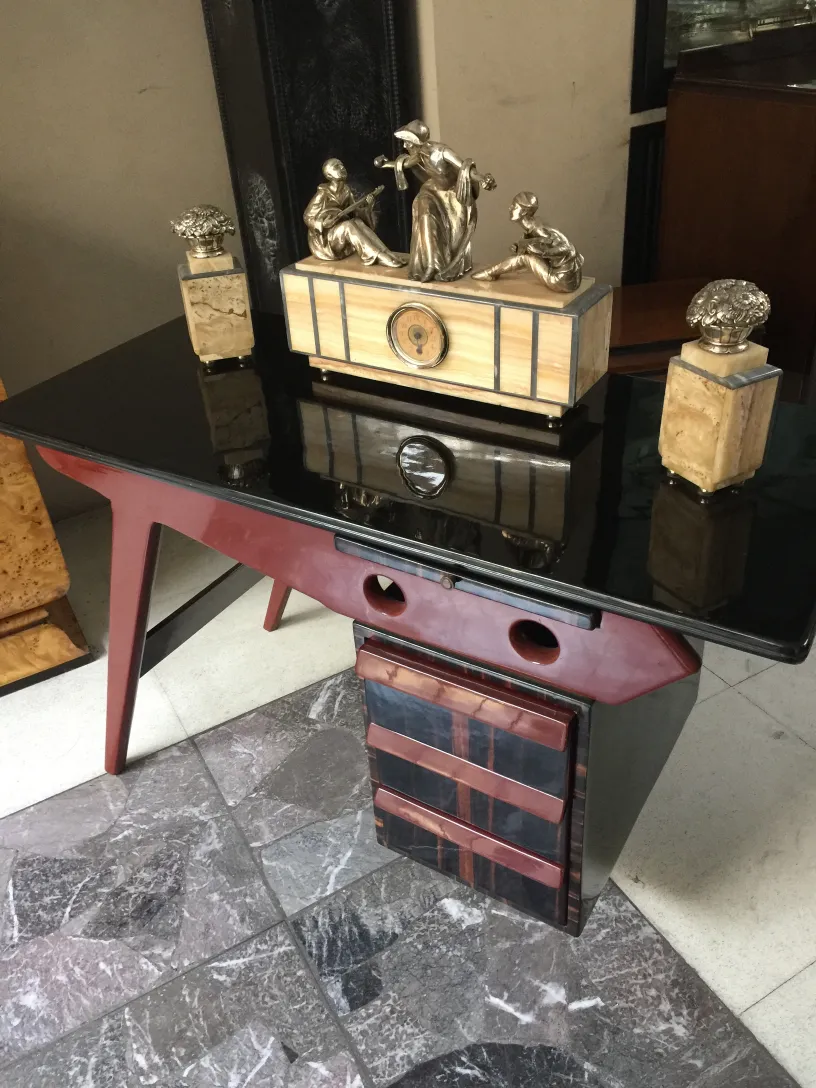 antique desk with elegant decorations and figures