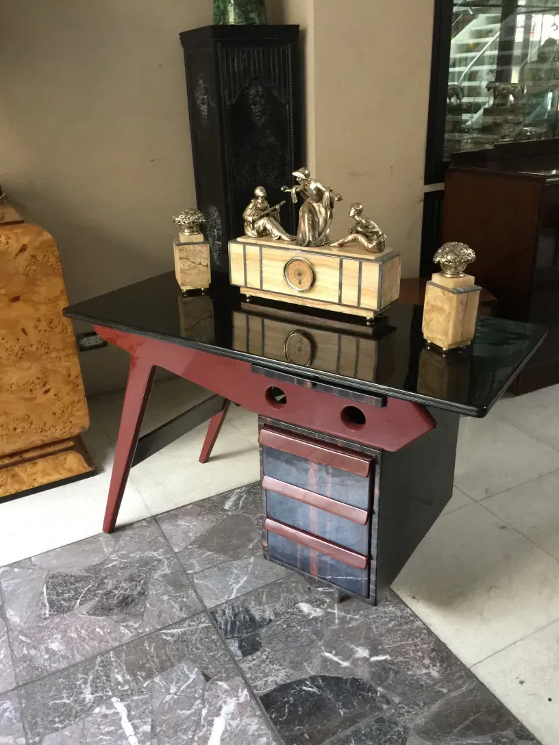 Antique desk with elegant design and decorative details in the environment.