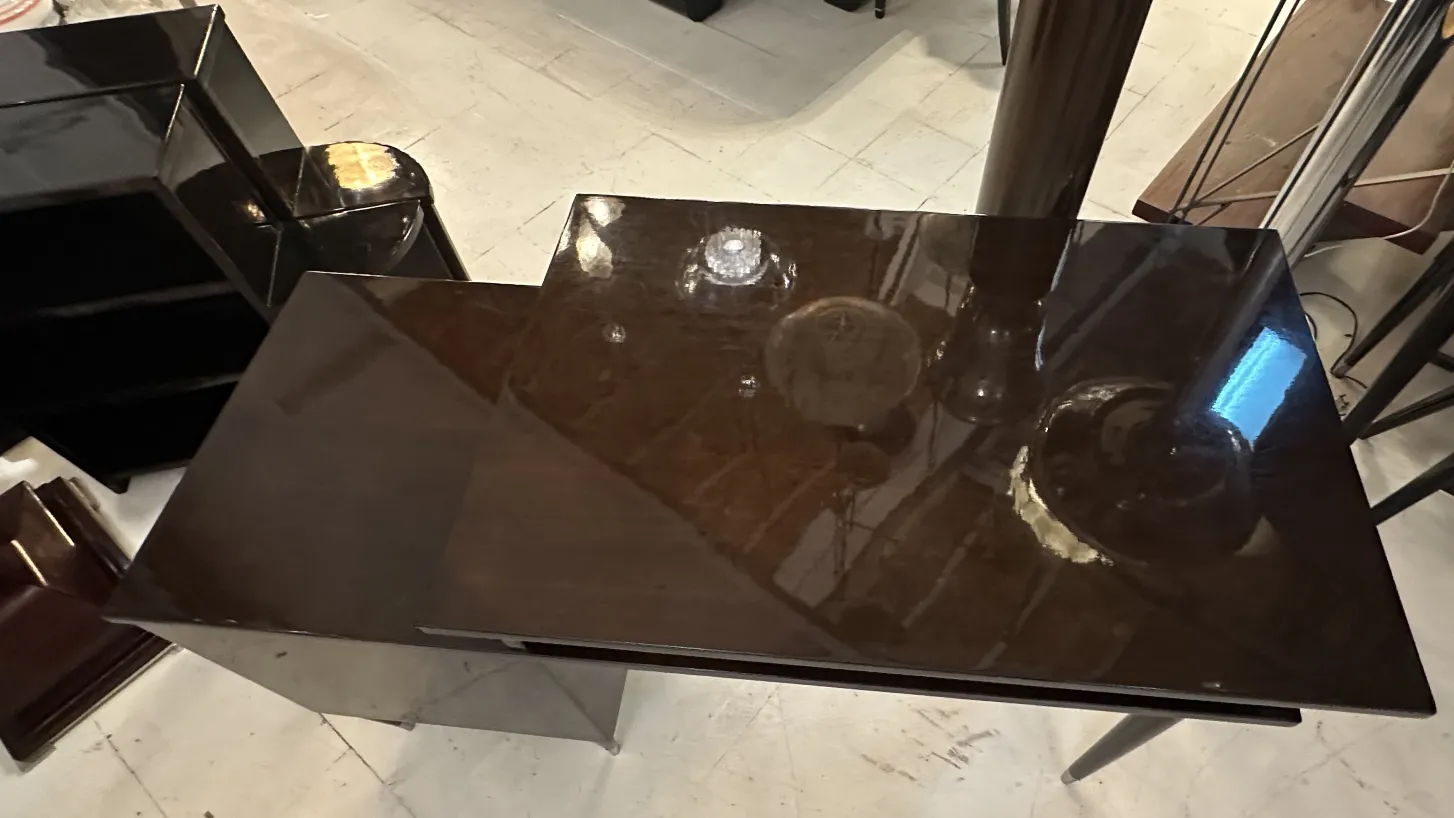 antique black desk with glossy finish and reflections