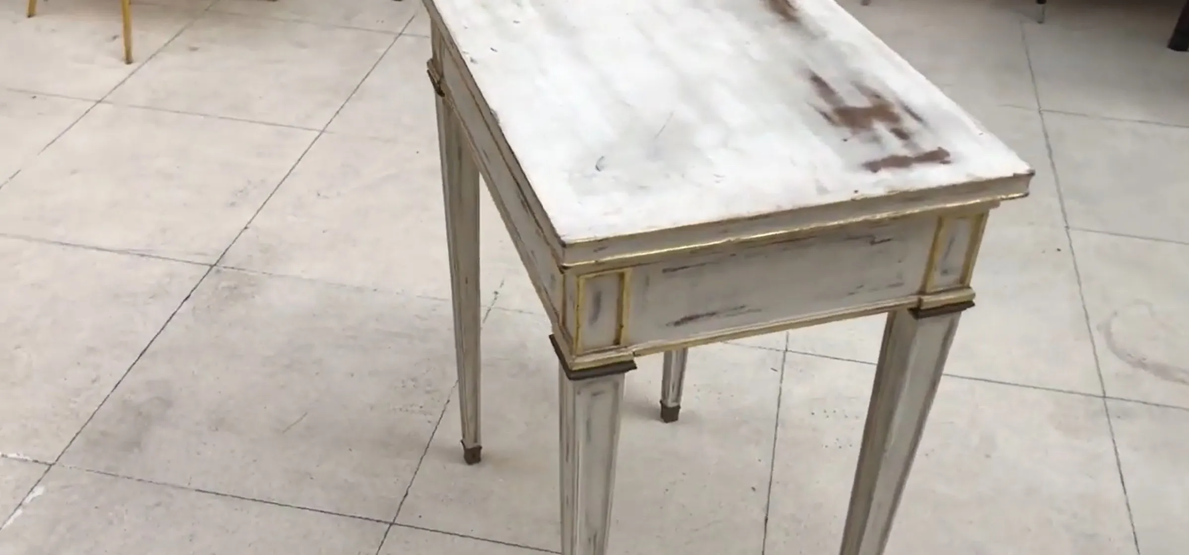 antique white desk with golden details, slim legs