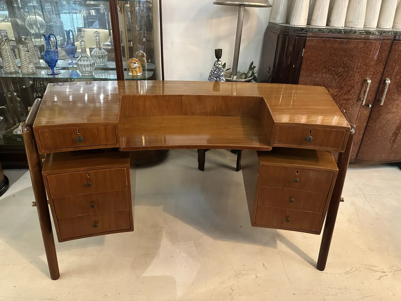 Antique desk with two drawers, set in a cozy ambiance.