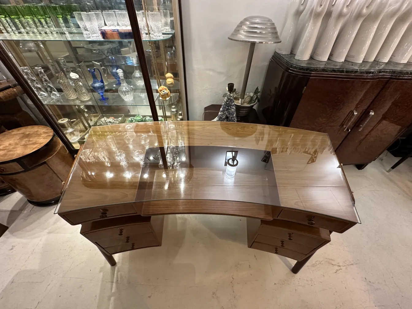 Antique desk with two drawers in an elegant setting.