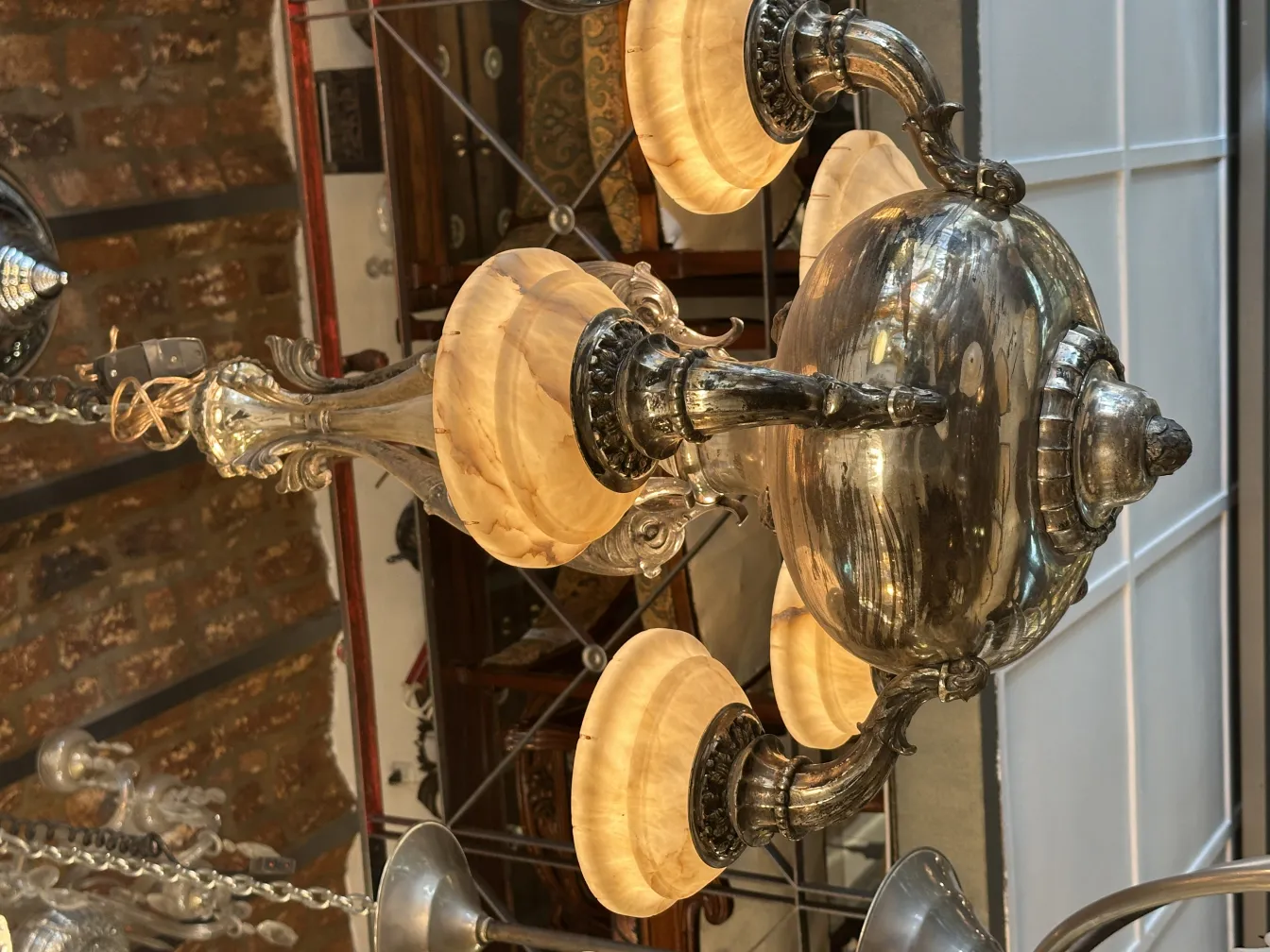 Antique hanging lamp with glass shades in a cozy setting