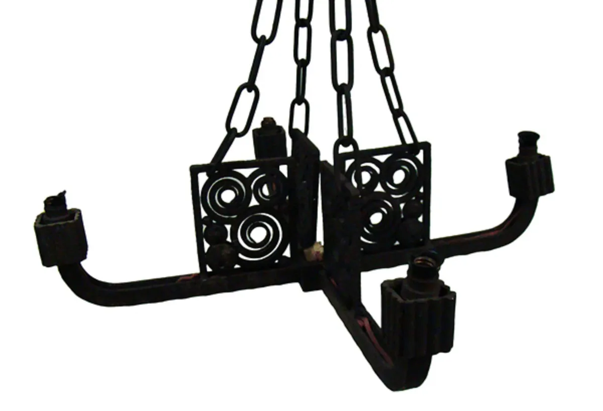 antique hanging lamp with decorative designs and chains